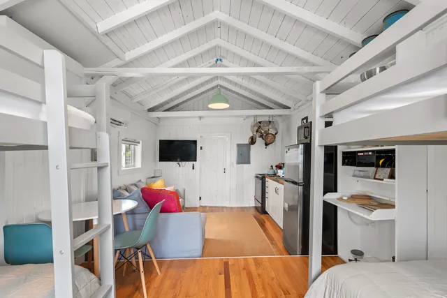 a living room with furniture and flat screen tv