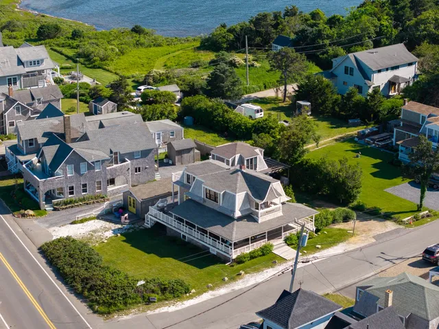 an aerial view of residential house with outdoor space and swimming pool