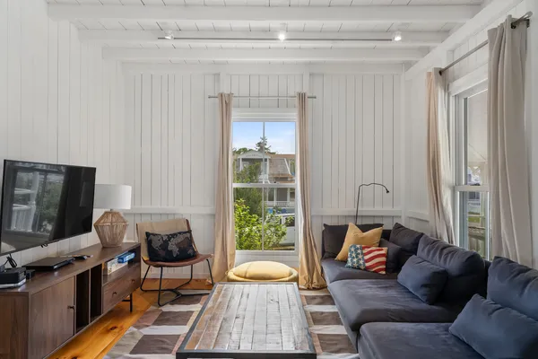 a living room with furniture and a window