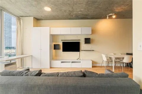 a bedroom with a bed and a couch