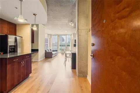 a kitchen with stainless steel appliances granite countertop a sink and a stove