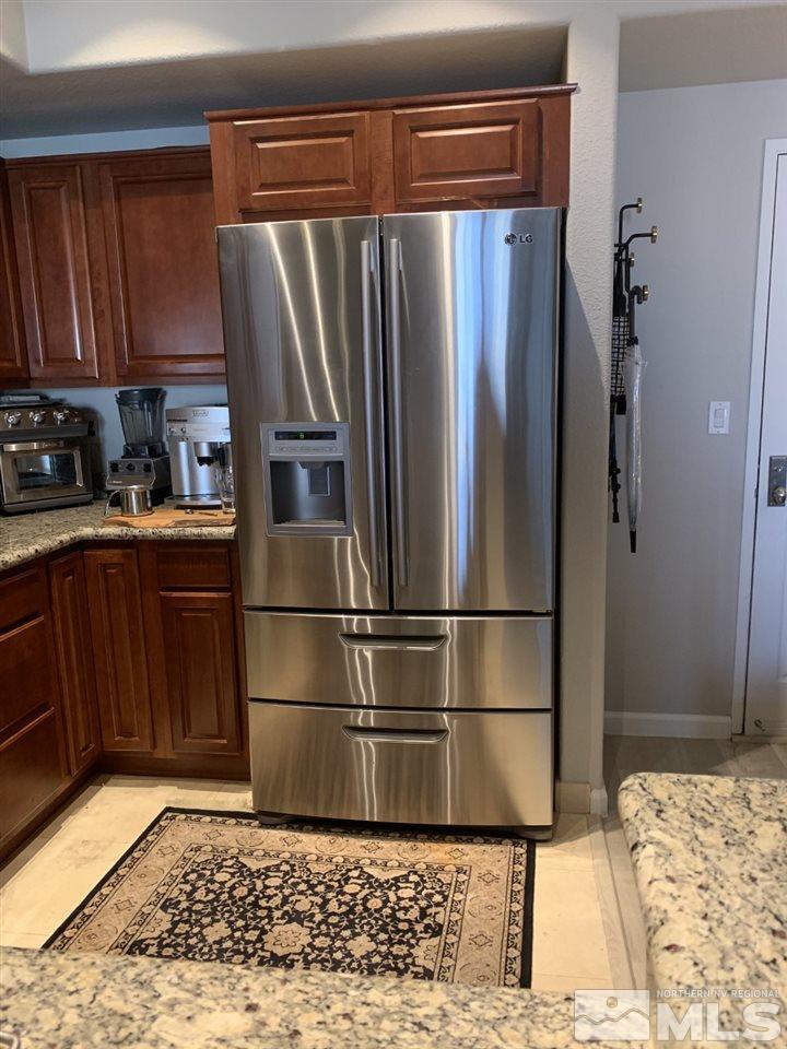 200 West 2nd Street, Unit 1502 Reno, NV 89501 - Photo 13 of 29 a metallic refrigerator freezer sitting in a kitchen