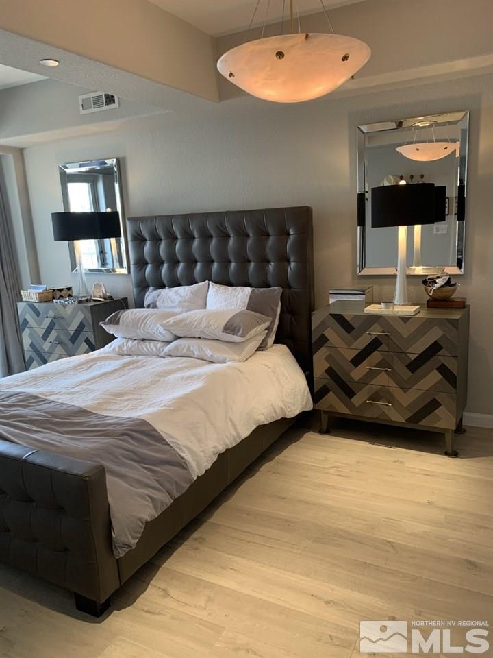 200 West 2nd Street, Unit 1502 Reno, NV 89501 - Photo 14 of 29 a bedroom with bed and window