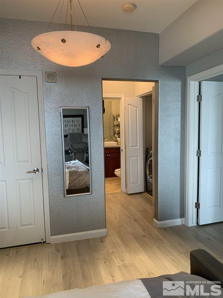 200 West 2nd Street, Unit 1502 Reno, NV 89501 - Photo 18 of 29 a view of a room with a wooden floor and a cabinet