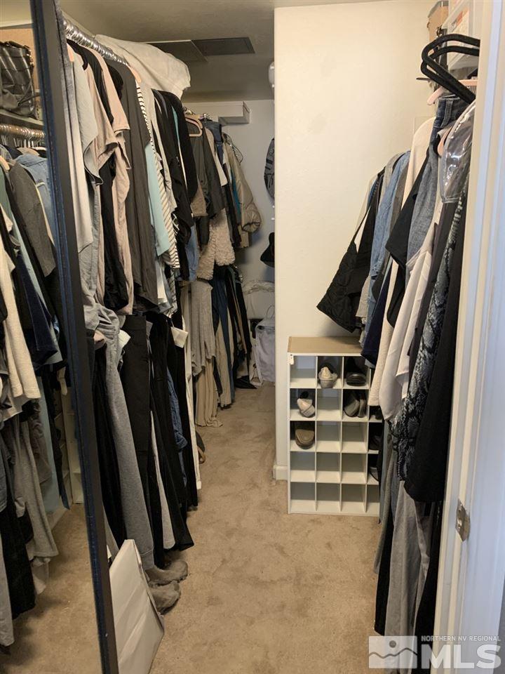 200 West 2nd Street, Unit 1502 Reno, NV 89501 - Photo 19 of 29 a view of walk in closet with clothes and shoes