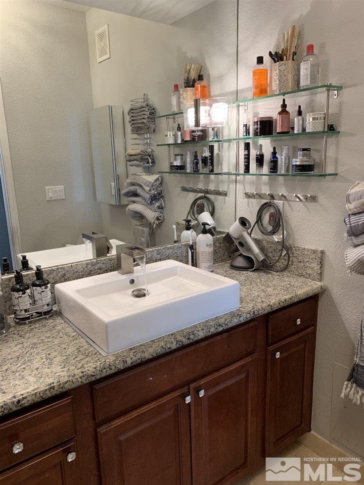 200 West 2nd Street, Unit 1502 Reno, NV 89501 - Photo 21 of 29 a kitchen with sink and cabinets