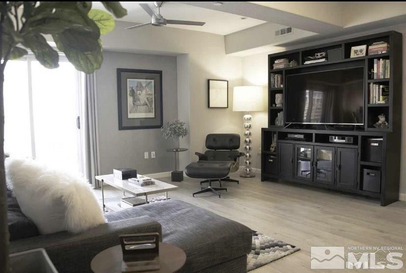 200 West 2nd Street, Unit 1502 Reno, NV 89501 - Photo 9 of 29 a living room with furniture and a flat screen tv