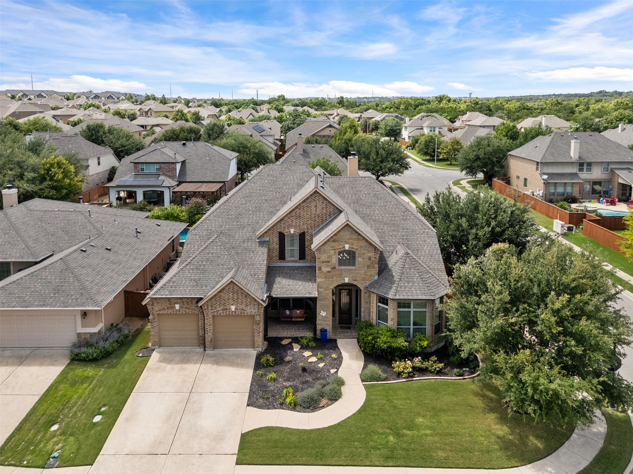 3021 Wedgescale Pass Leander, TX 78641 - Photo 38 of 40 an aerial view of a house with a yard garage and lake view