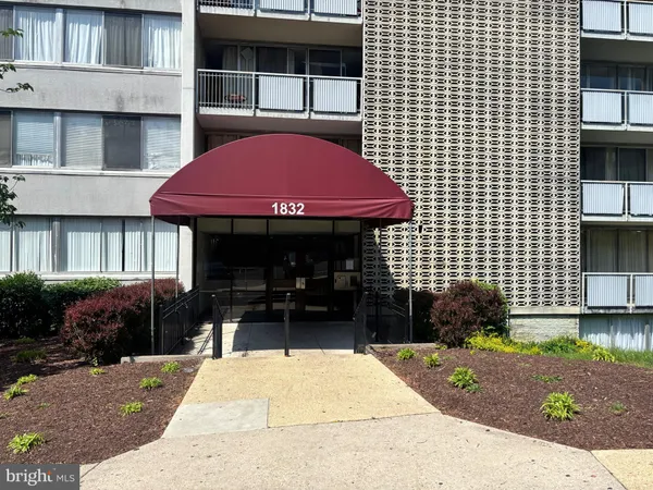 a front view of a building with garden