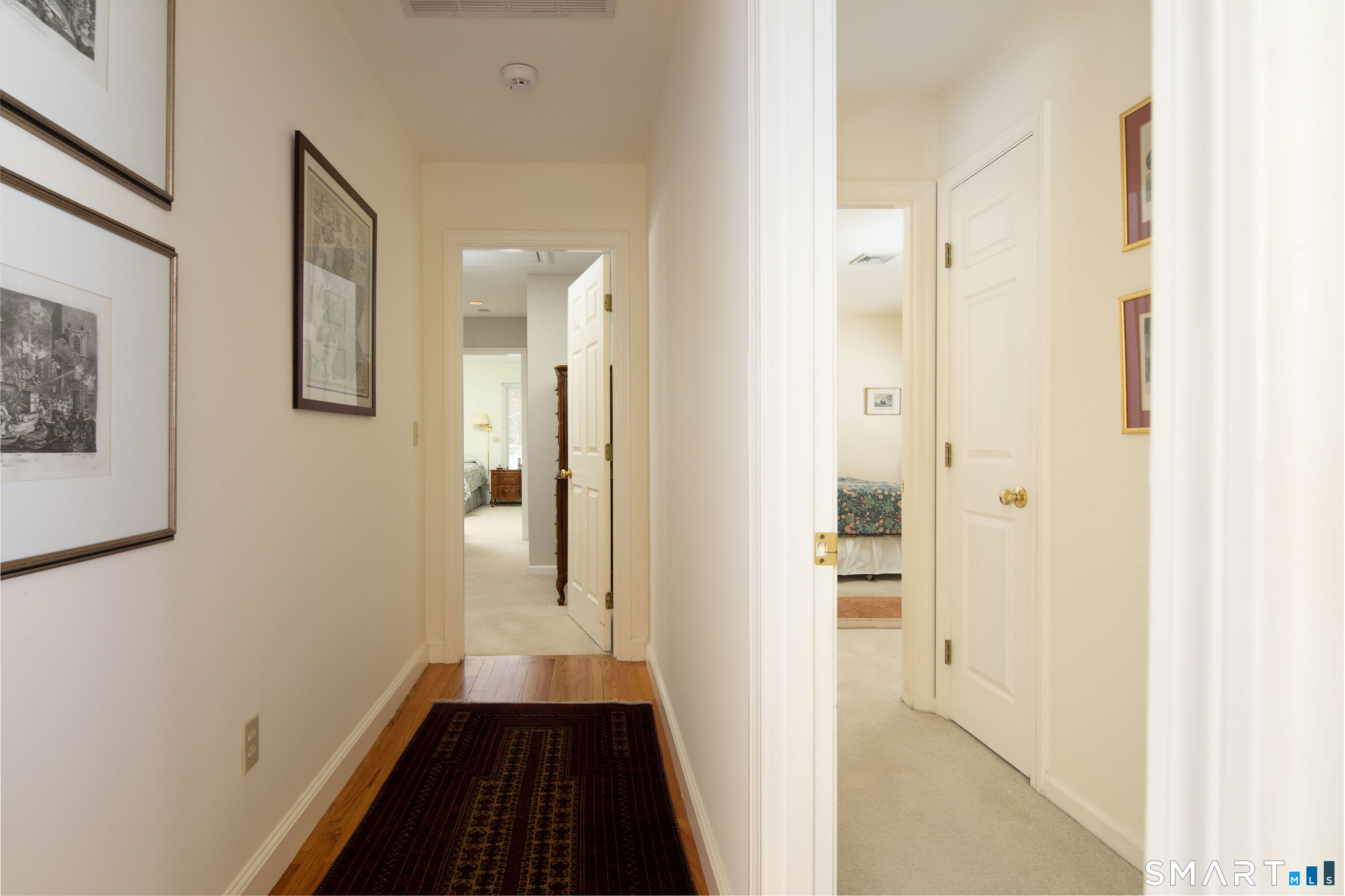 59 Cornwall Bridge Road Sharon, CT 06069 - Photo 12 of 26 a view of a hallway with wooden floor and staircase