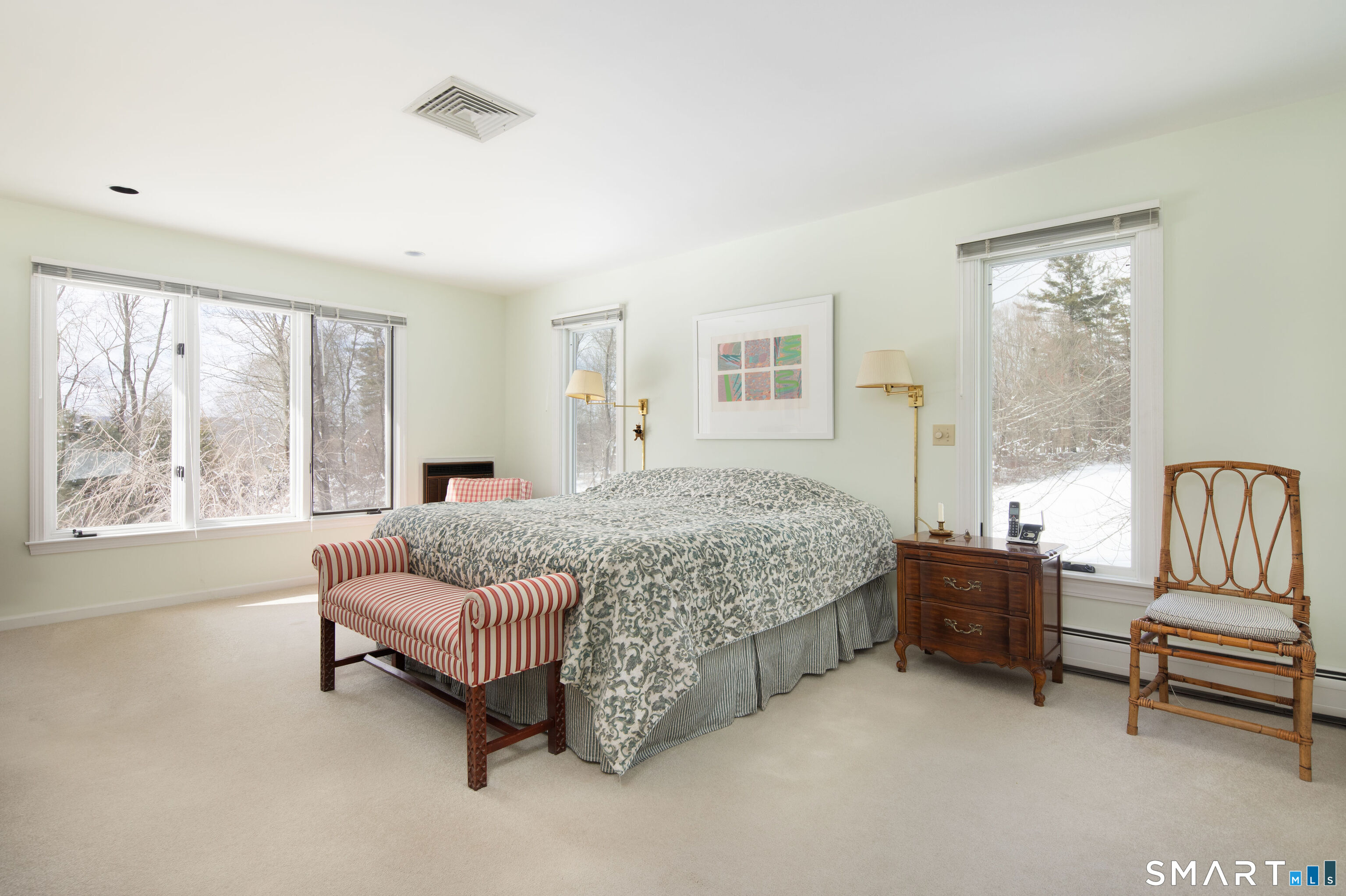 59 Cornwall Bridge Road Sharon, CT 06069 - Photo 13 of 26 a bedroom with a bed and a couch next to a window