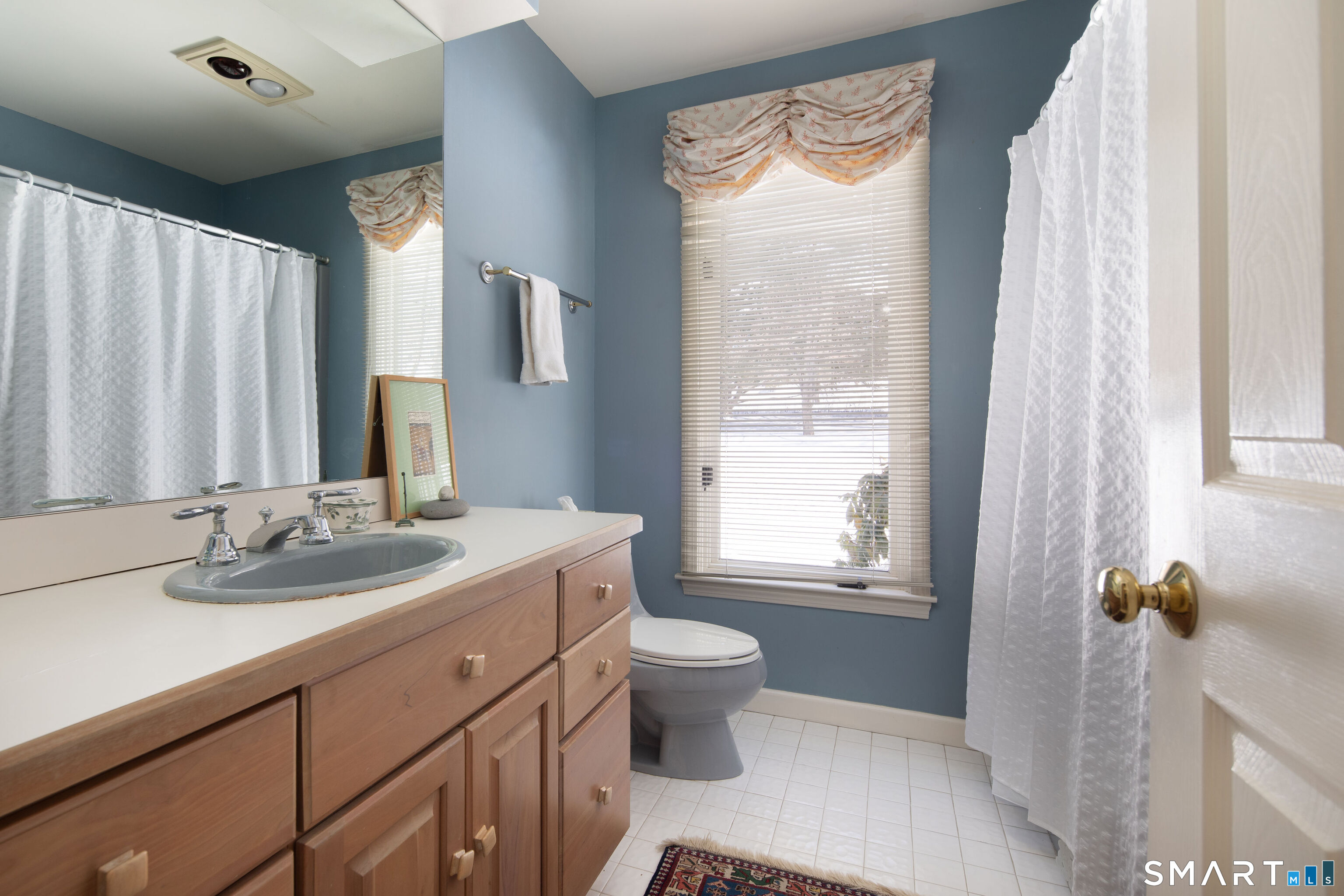 59 Cornwall Bridge Road Sharon, CT 06069 - Photo 17 of 26 a bathroom with a granite countertop sink toilet and mirror