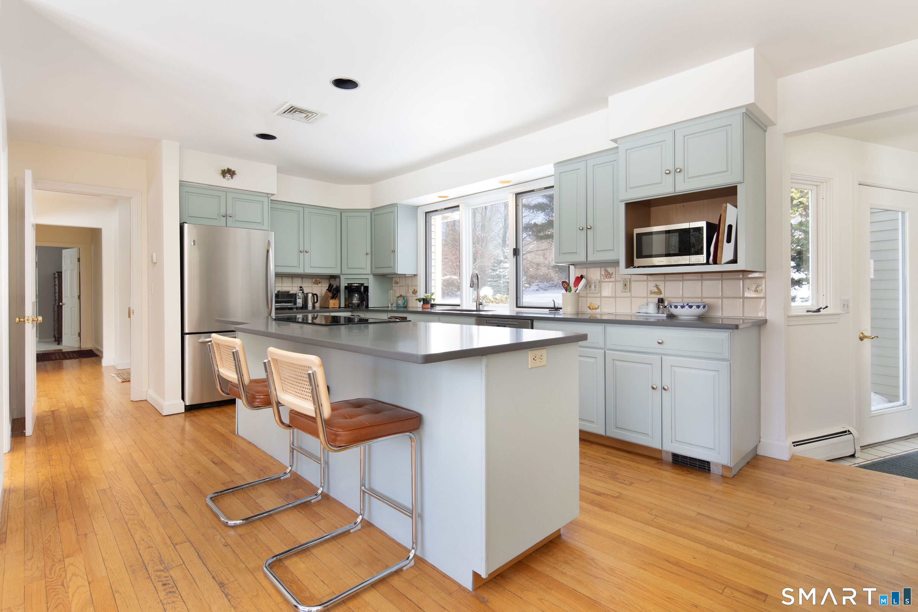59 Cornwall Bridge Road Sharon, CT 06069 - Photo 6 of 26 a kitchen with stainless steel appliances kitchen island granite countertop a stove and a sink