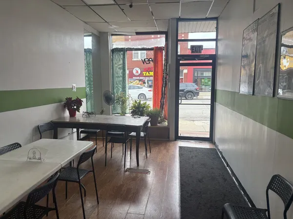 a view of a dining room with furniture and window