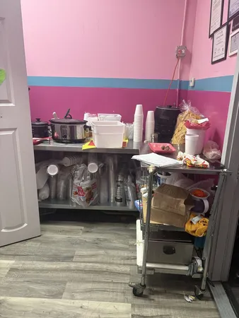 a room with a fireplace and cabinets