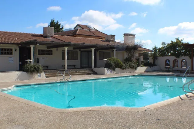 a view of a house with a swimming pool