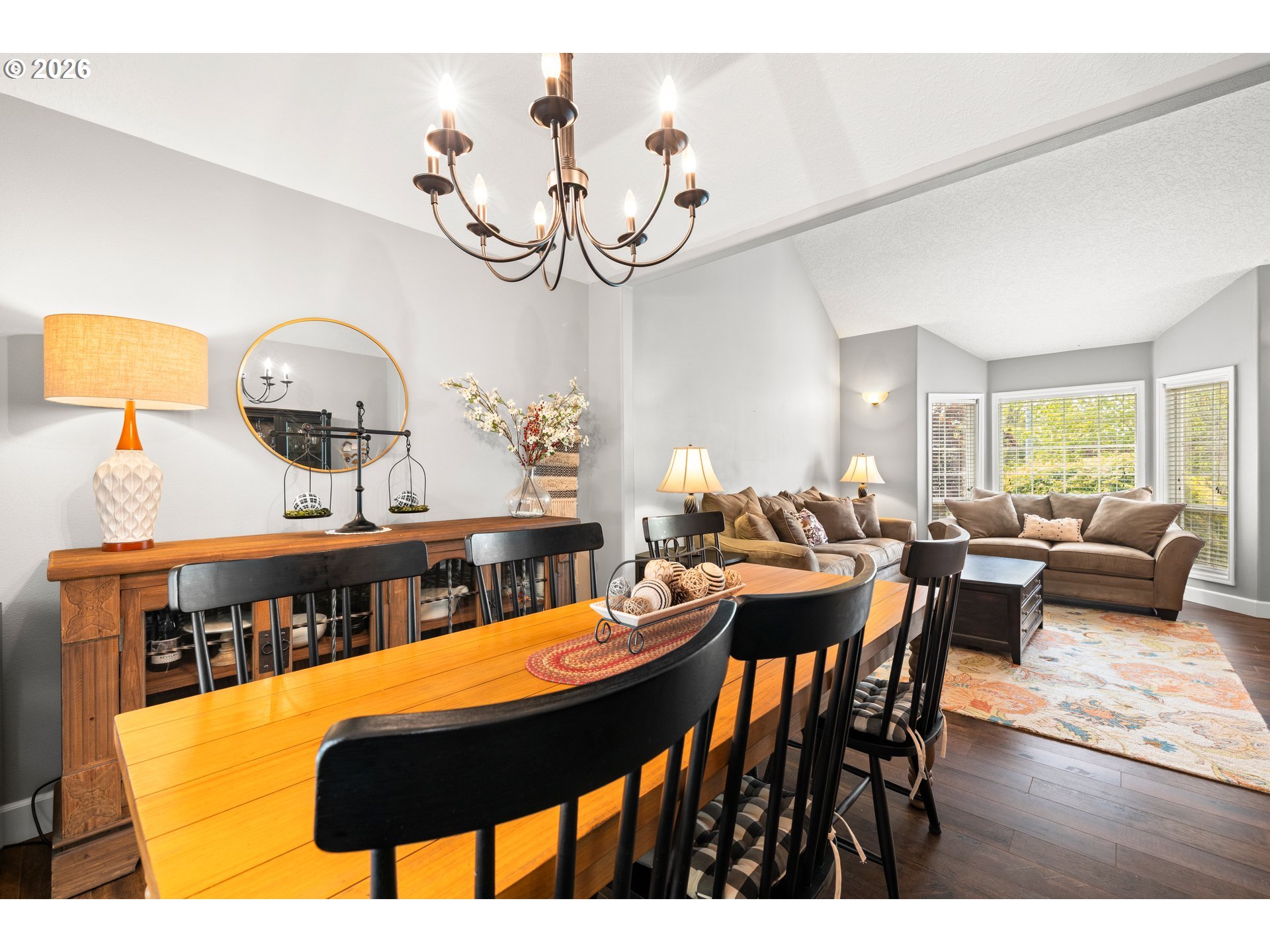 4549 Southeast 10th Terrace Gresham, OR 97080 - Photo 11 of 44 a view of a dining room with furniture and a chandelier
