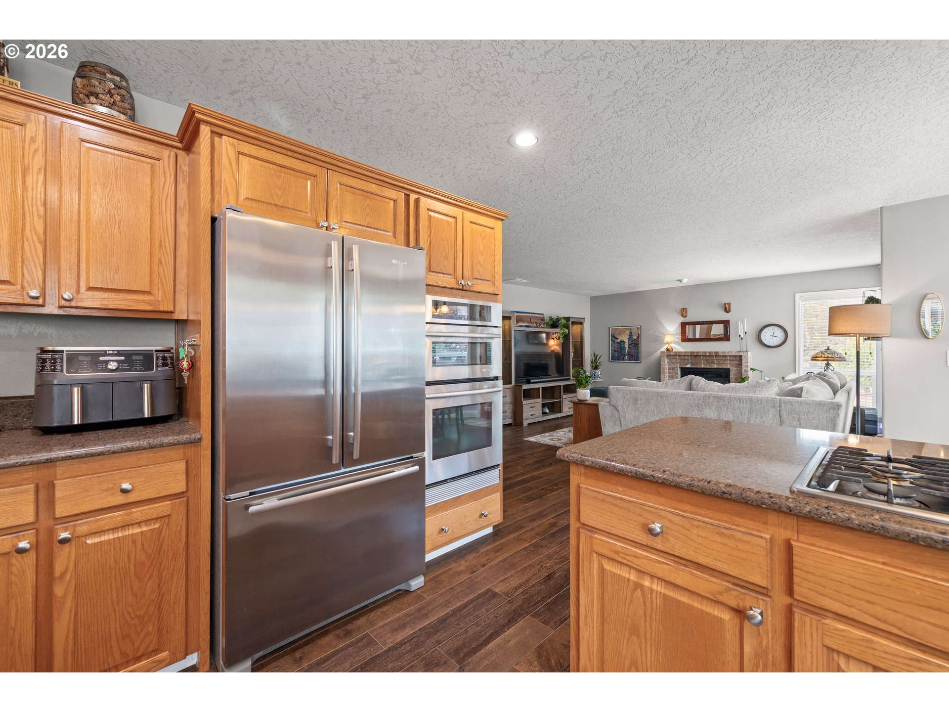 4549 Southeast 10th Terrace Gresham, OR 97080 - Photo 14 of 44 a kitchen with stainless steel appliances granite countertop a refrigerator and a sink