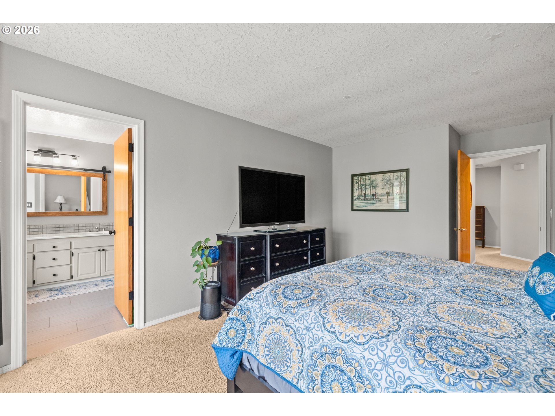 4549 Southeast 10th Terrace Gresham, OR 97080 - Photo 20 of 44 a bedroom with a bed and a flat screen tv