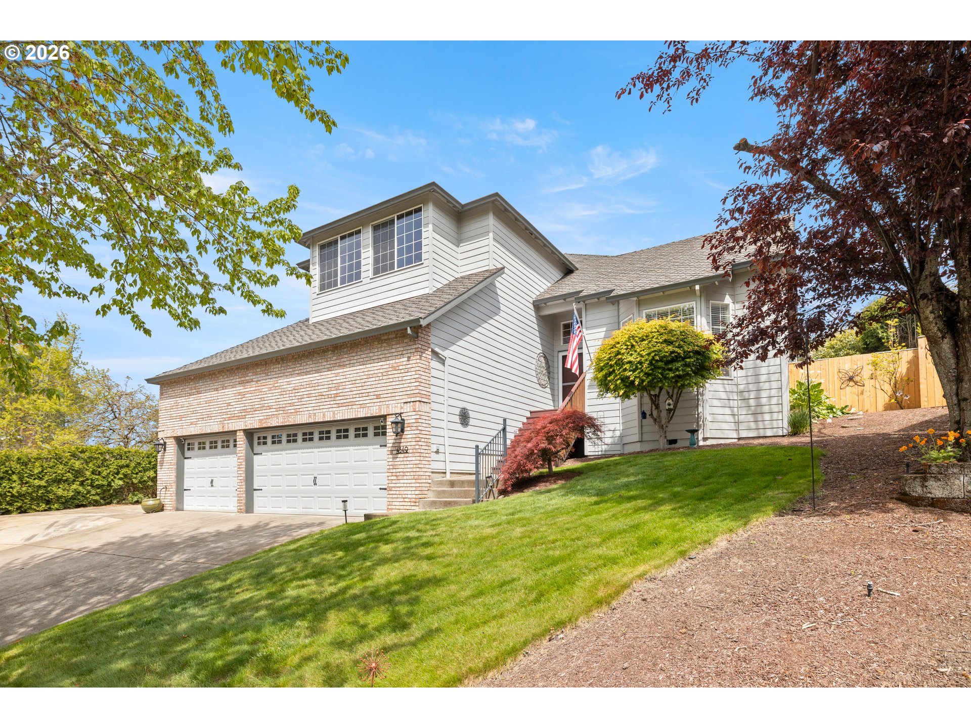 4549 Southeast 10th Terrace Gresham, OR 97080 - Photo 2 of 44 a view of a house with a yard and a large tree