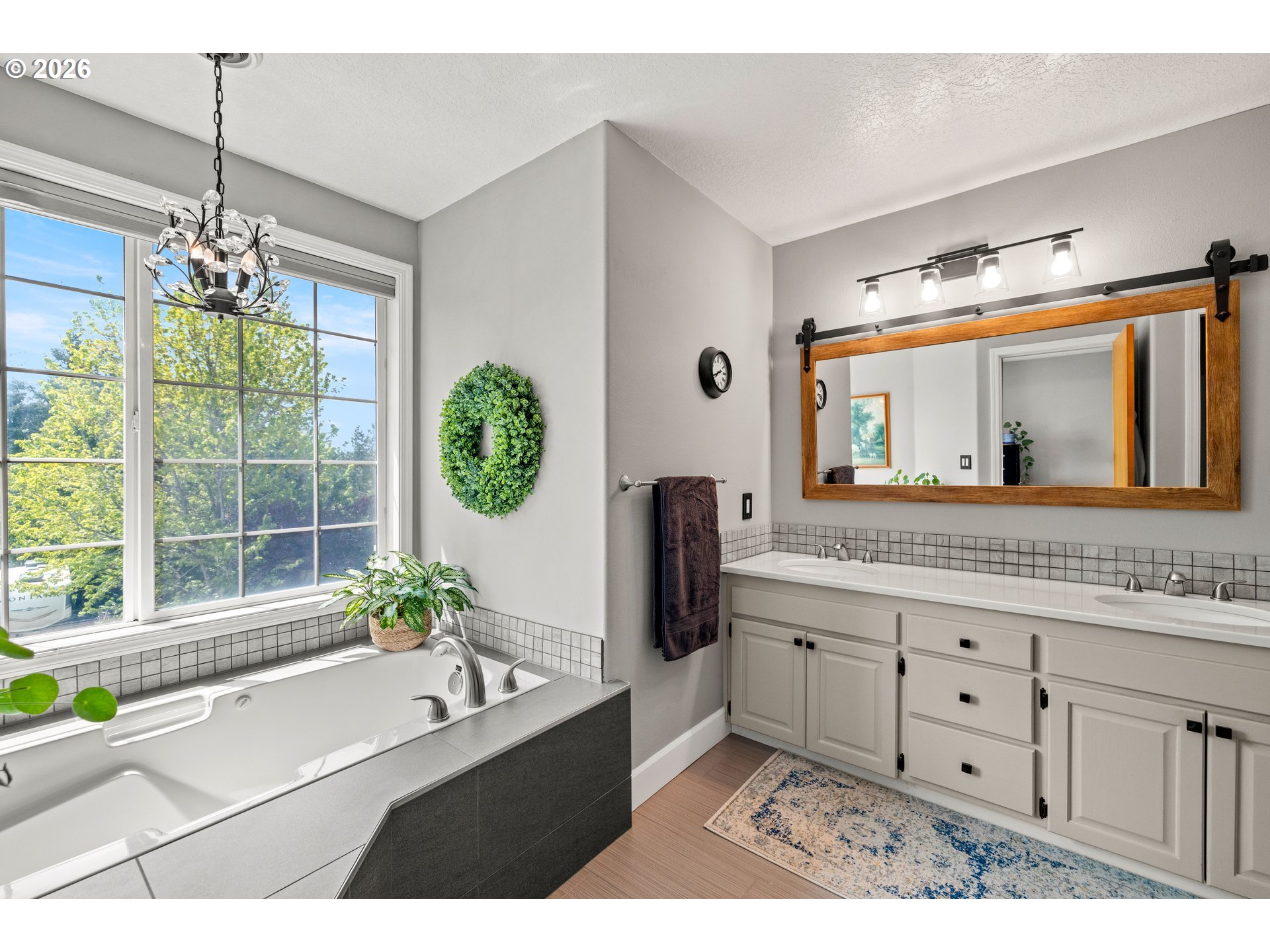4549 Southeast 10th Terrace Gresham, OR 97080 - Photo 21 of 44 a bathroom with a double vanity sink and a mirror