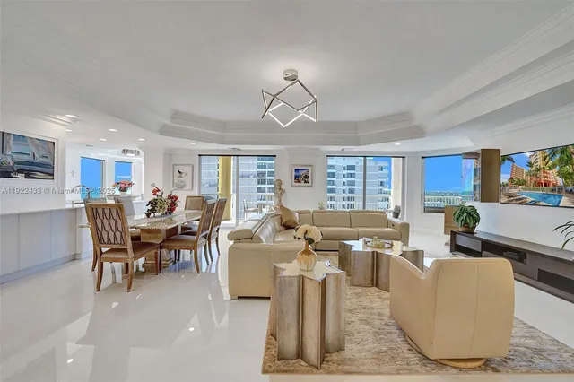a living room with furniture wooden floor and window