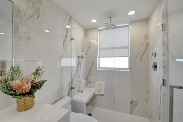 a bedroom with a large bed and a couch