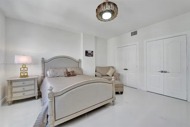 a bathroom with a tub a sink a mirror and a bathtub