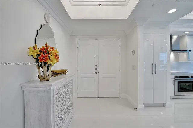 a white bath tub sitting next to a white sink