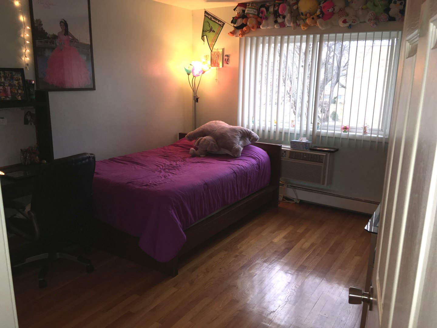 708 Dempster Street, Unit F202 Mount Prospect, IL 60056 - Photo 11 of 14 a bed sitting in a bedroom next to a window