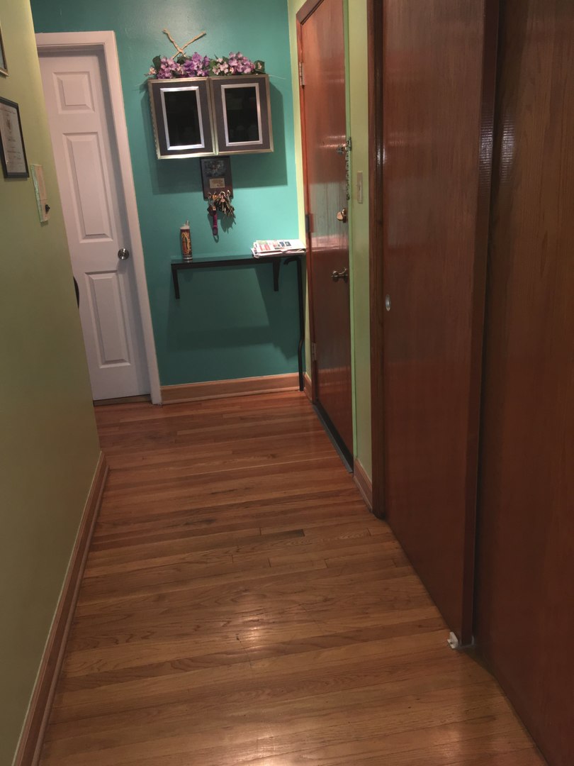 708 Dempster Street, Unit F202 Mount Prospect, IL 60056 - Photo 2 of 14 a view of a hallway