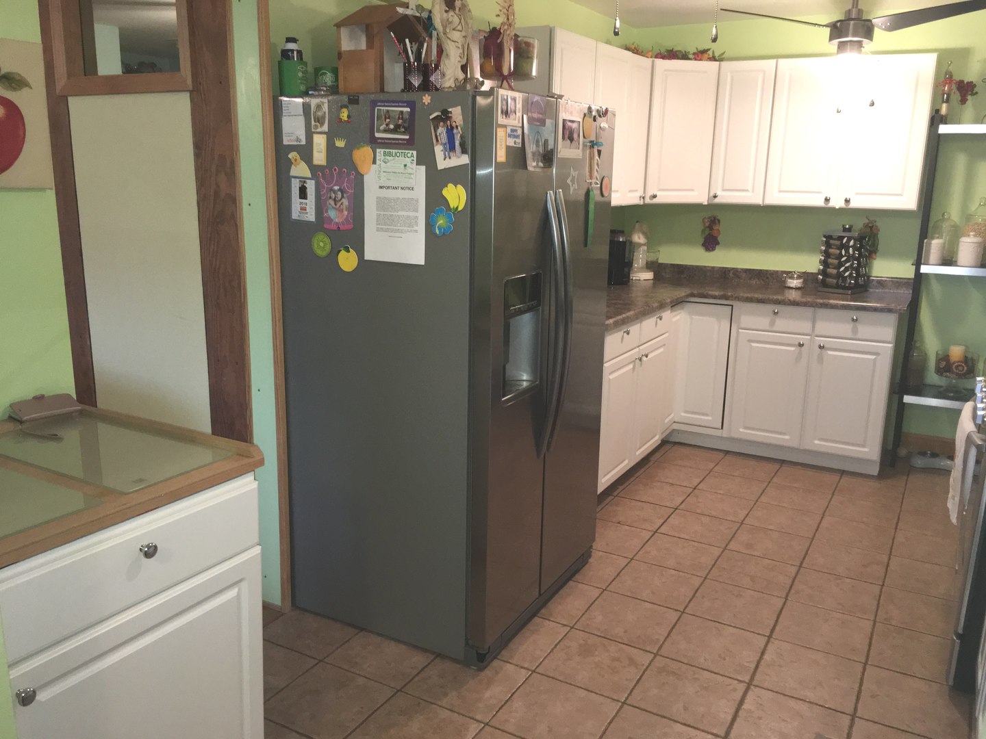 708 Dempster Street, Unit F202 Mount Prospect, IL 60056 - Photo 4 of 14 a kitchen with stainless steel appliances granite countertop a refrigerator and a sink