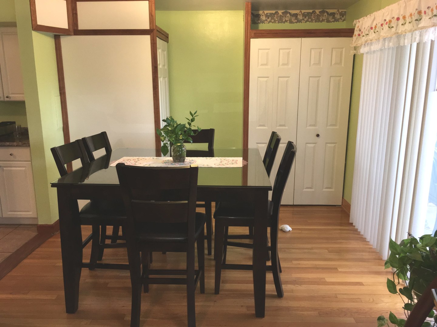 708 Dempster Street, Unit F202 Mount Prospect, IL 60056 - Photo 6 of 14 a view of a dining room with furniture and a window