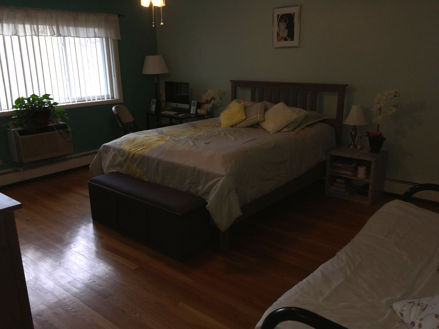 708 Dempster Street, Unit F202 Mount Prospect, IL 60056 - Photo 10 of 14 a bedroom with a bed wooden floor and window