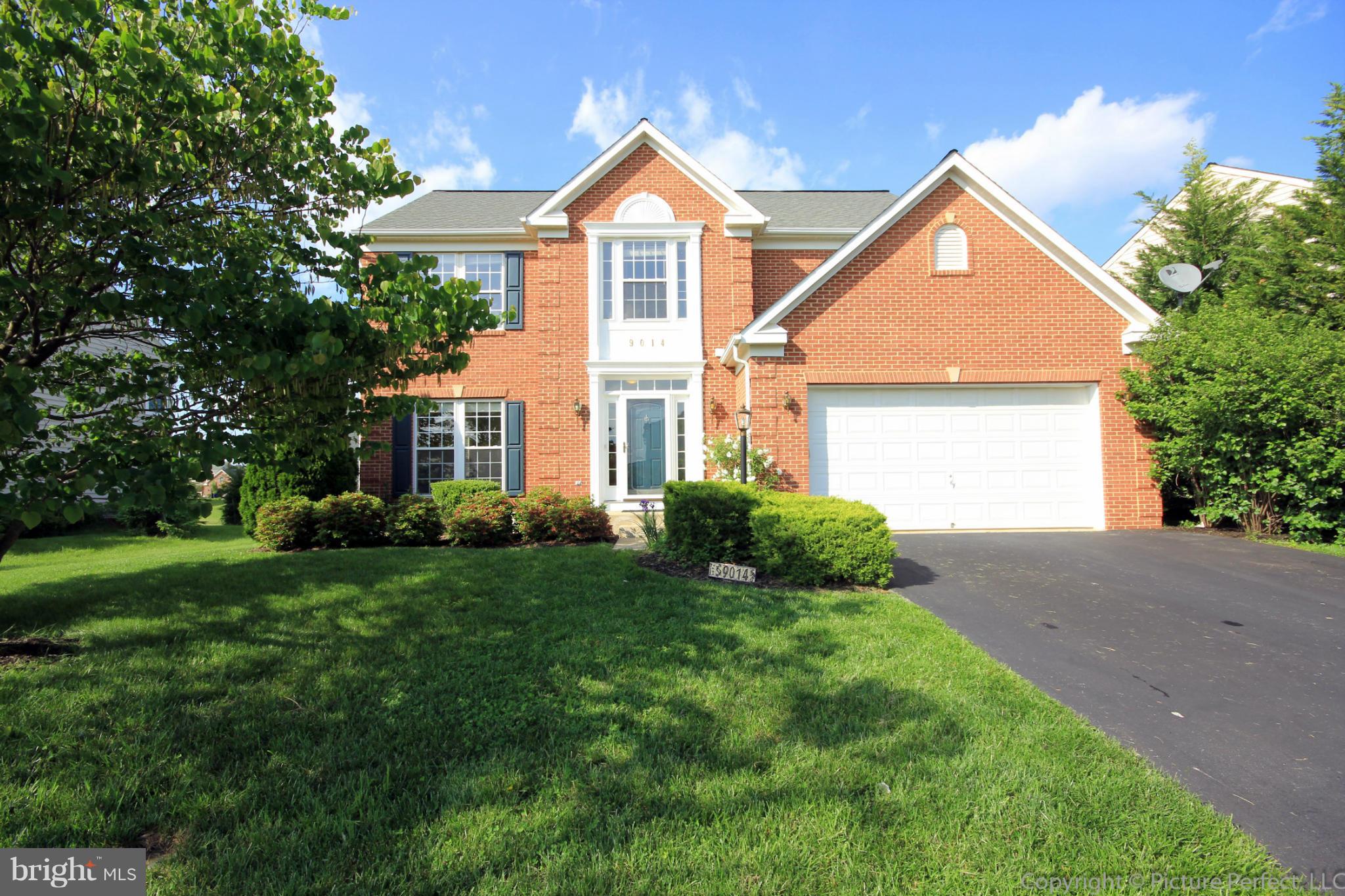 9014 Bealls Farm Road Frederick, MD 21704 - Photo 1 of 30 a front view of a house with a yard and garage