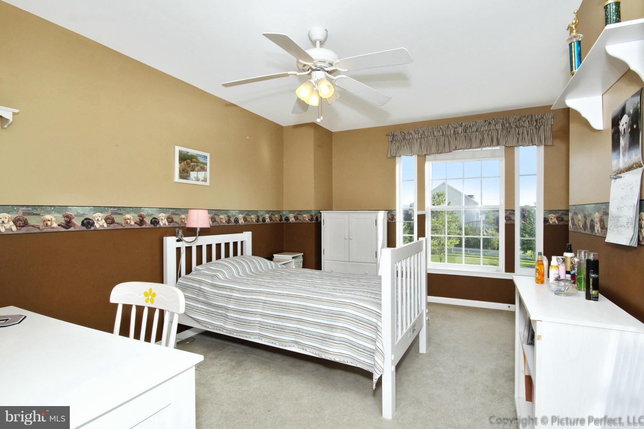 9014 Bealls Farm Road Frederick, MD 21704 - Photo 12 of 30 a bedroom with a bed and a large window with balcony view