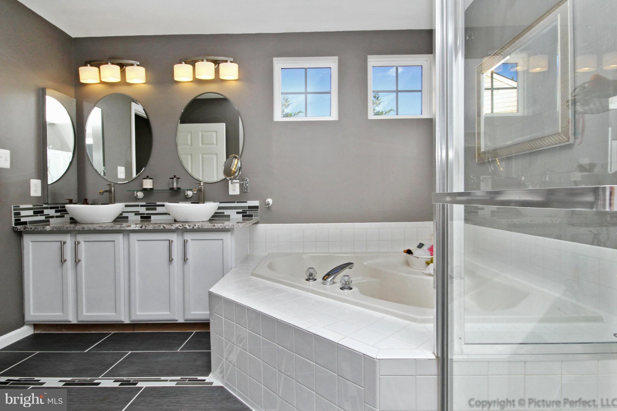 9014 Bealls Farm Road Frederick, MD 21704 - Photo 16 of 30 a bathroom with a sink and a mirror