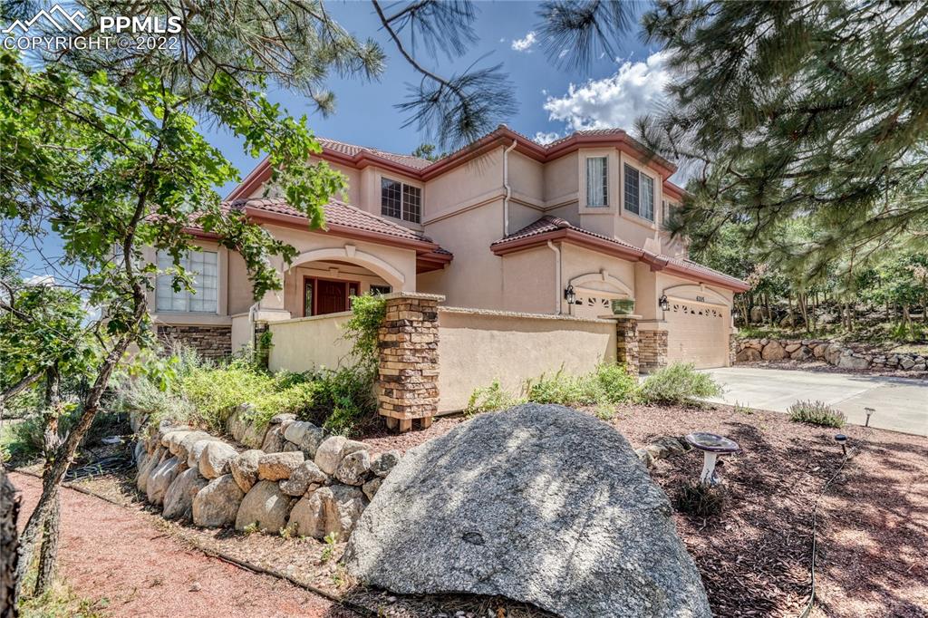 6205 Colfax Terrace Colorado Springs, CO 80906 - Photo 3 of 43 front view of a house with a yard