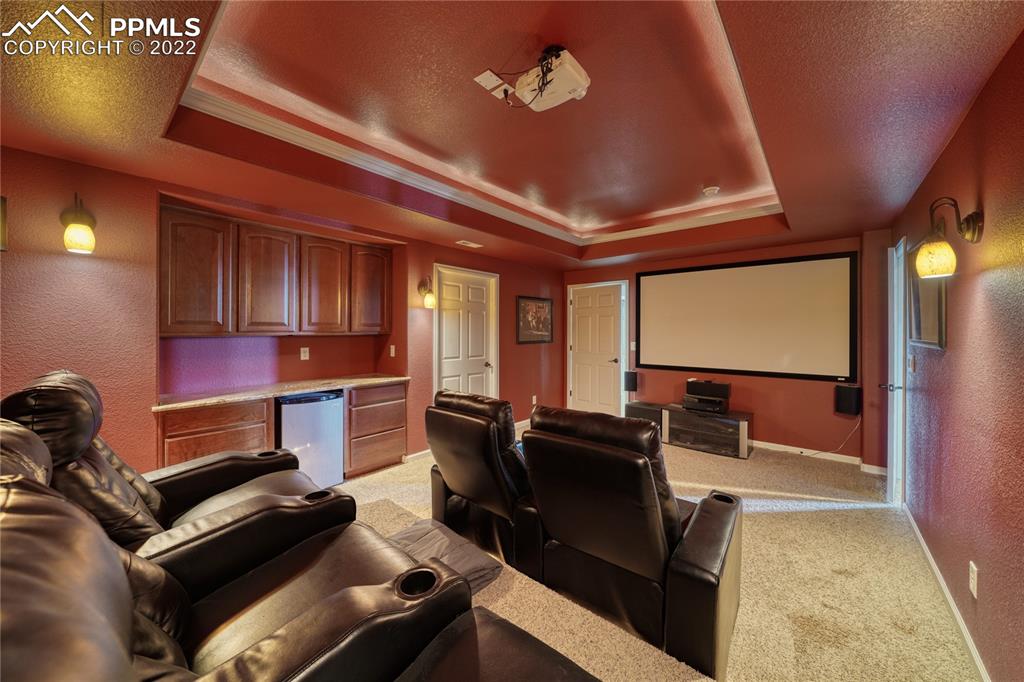6205 Colfax Terrace Colorado Springs, CO 80906 - Photo 32 of 43 a room with furniture projector and screen