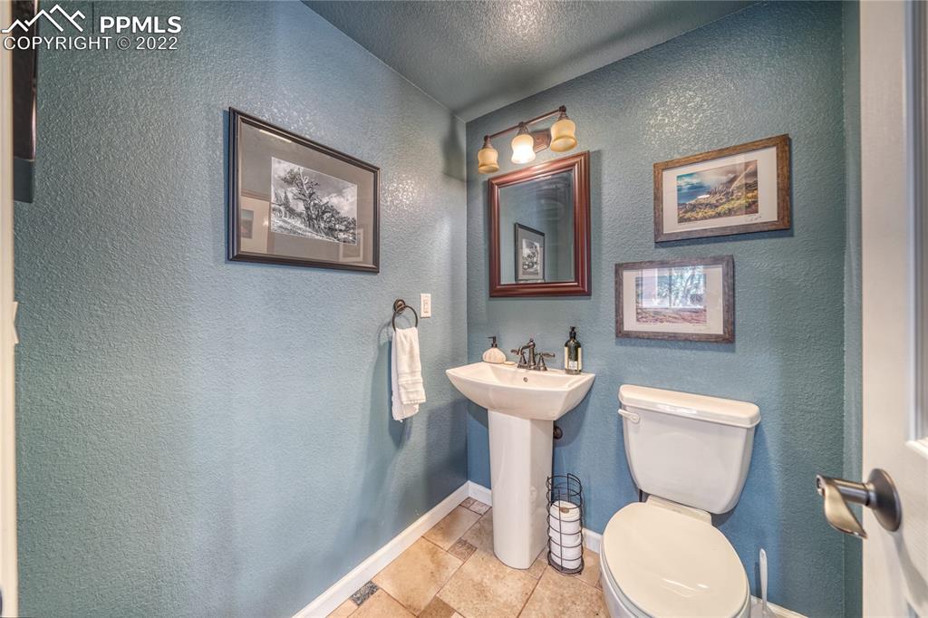 6205 Colfax Terrace Colorado Springs, CO 80906 - Photo 37 of 43 a white toilet sitting next to a bathroom sink