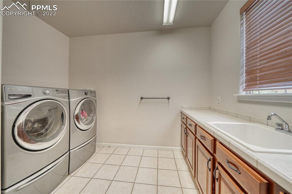 6205 Colfax Terrace Colorado Springs, CO 80906 - Photo 38 of 43 a utility room with dryer and washer