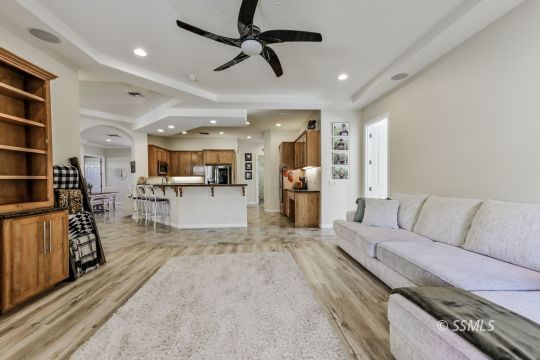1213 Carolyn Street Ridgecrest, CA 93555 - Photo 16 of 50 a living room with furniture and kitchen view