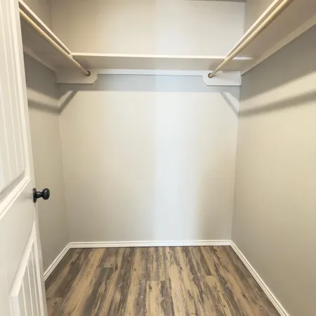 a view of an empty walk in closet