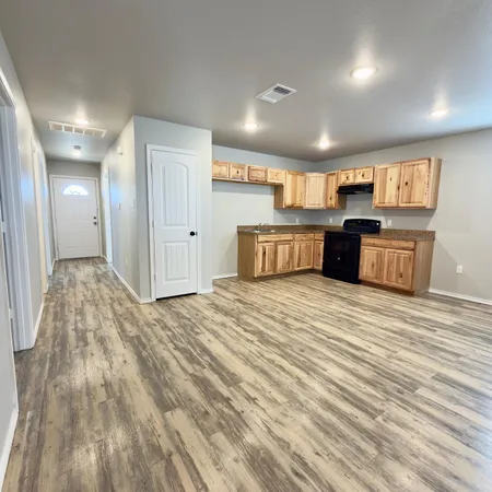 a large kitchen with stainless steel appliances kitchen island a large island in the center