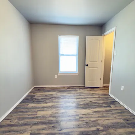 a view of an empty room and window