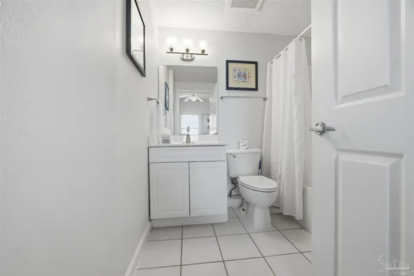 a bathroom with a sink a toilet and tub