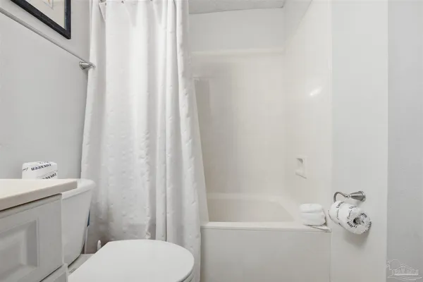 a bedroom with two beds and a mirror