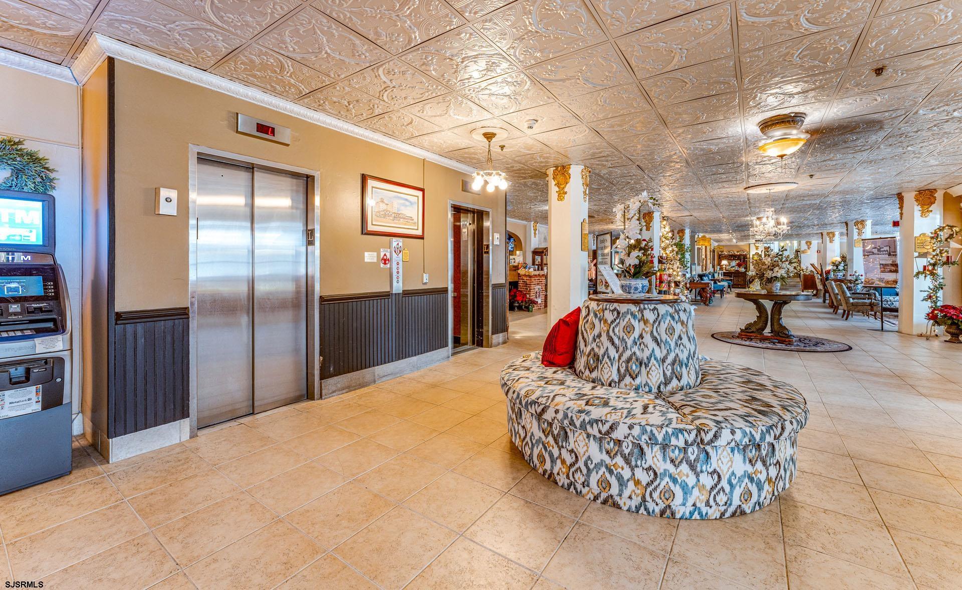 719 East 11th Street, Unit 810 Ocean City, NJ 08226 - Photo 15 of 25 a living room with stainless steel appliances kitchen island granite countertop furniture and a kitchen view