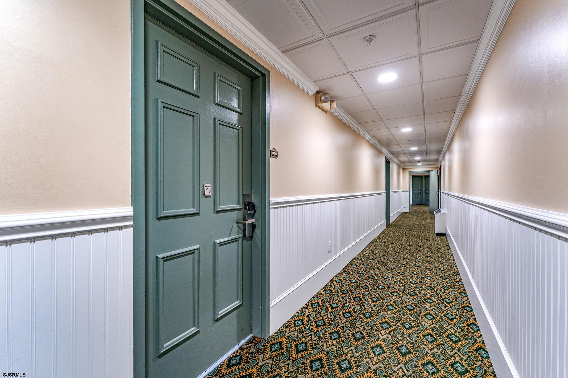 719 East 11th Street, Unit 810 Ocean City, NJ 08226 - Photo 3 of 25 a view of hallway with stairs