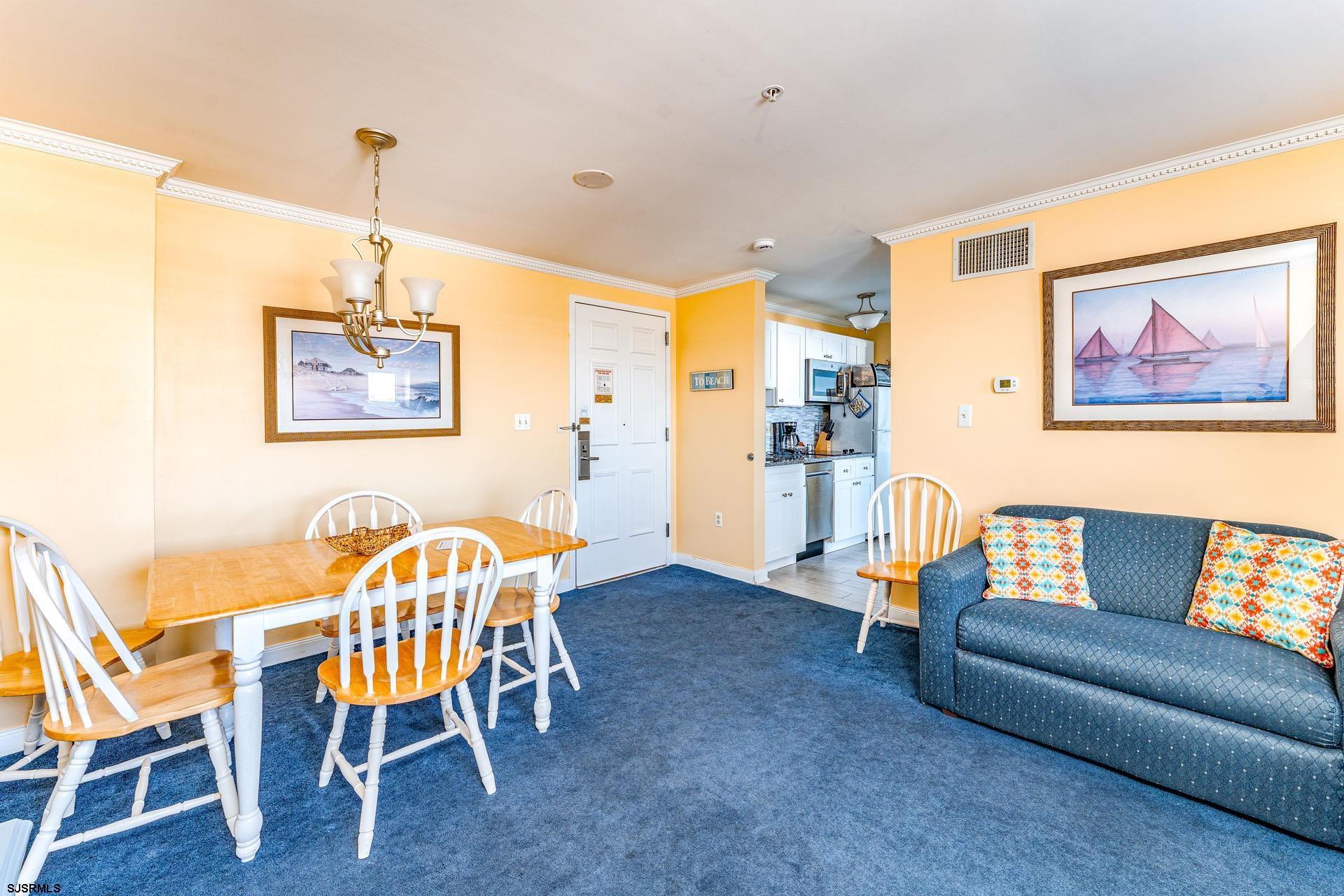 719 East 11th Street, Unit 810 Ocean City, NJ 08226 - Photo 5 of 25 a view of a livingroom with furniture and a dining table
